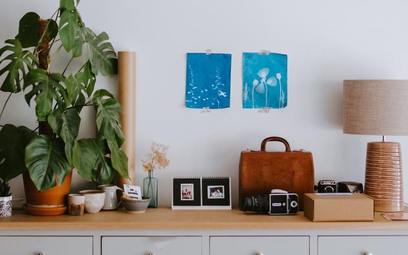 large dresser with a variety of decor on it